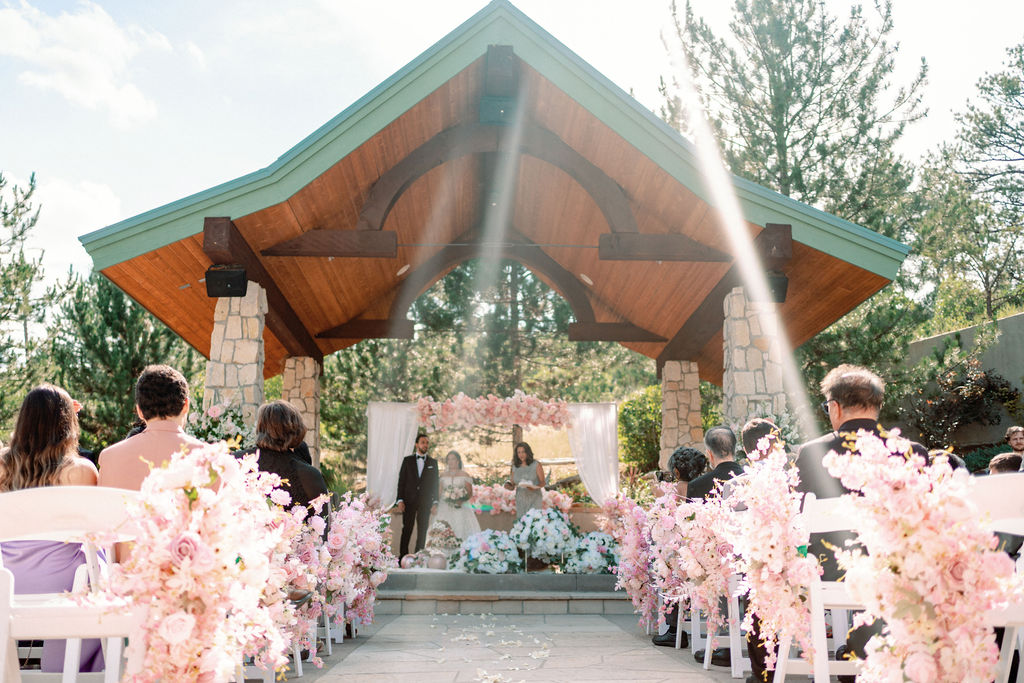 A look up the aisle to a ceremony under the gazebo at Cielo At Castle Pines