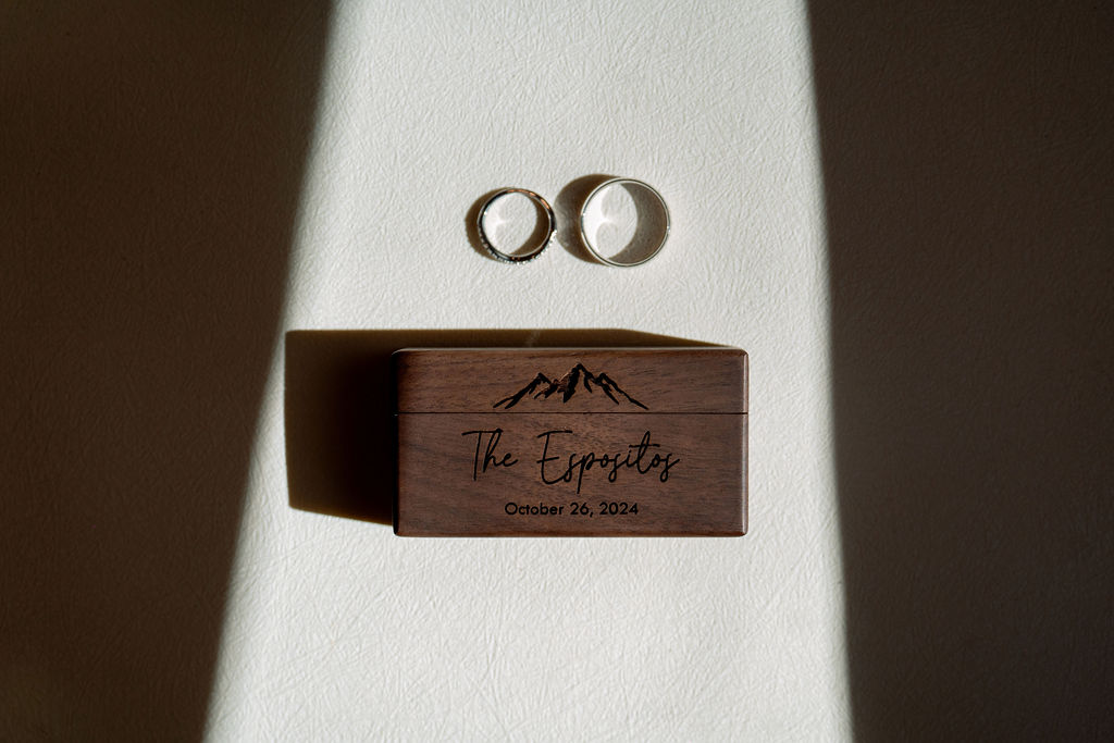 Details of a custom ring box with rings on a table