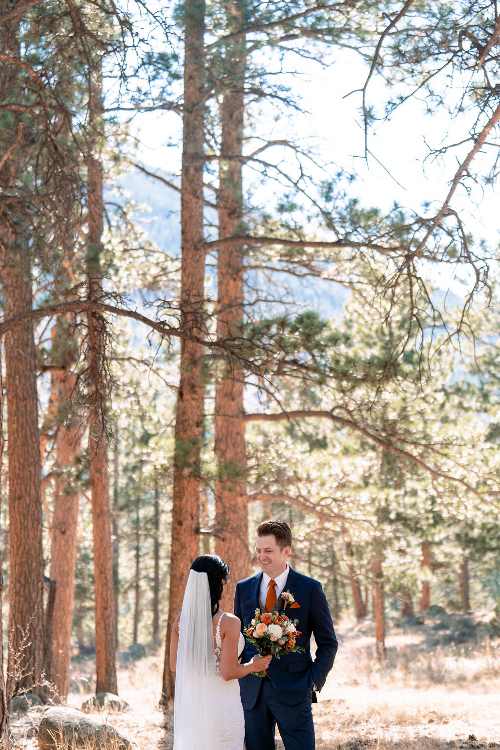 Newlyweds chat in the forest