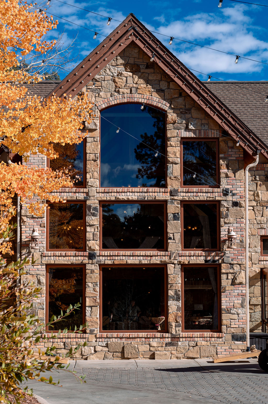 Details of the facade of the Della Terra Wedding venue with stonework and large windows