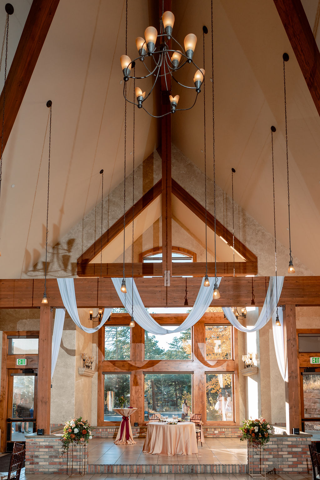 Details of a Della Terra Wedding reception set up with white linens