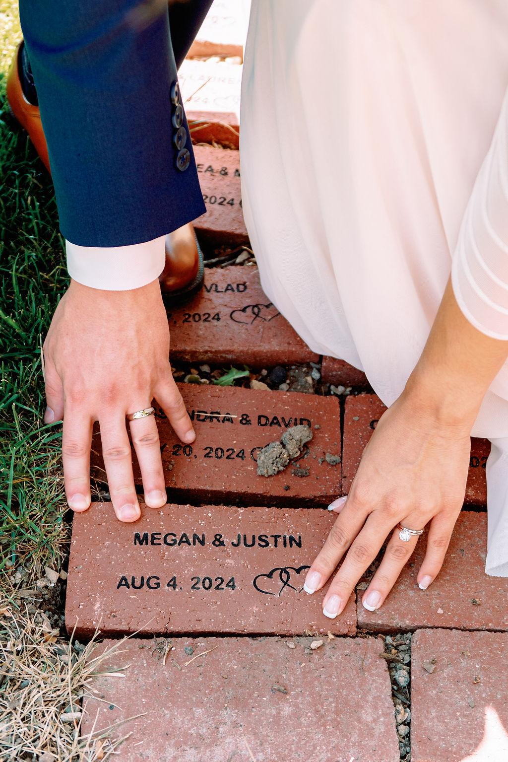 A bride and groom install their stamped brick with wedding date at Tapestry House By Wedgewood Weddings