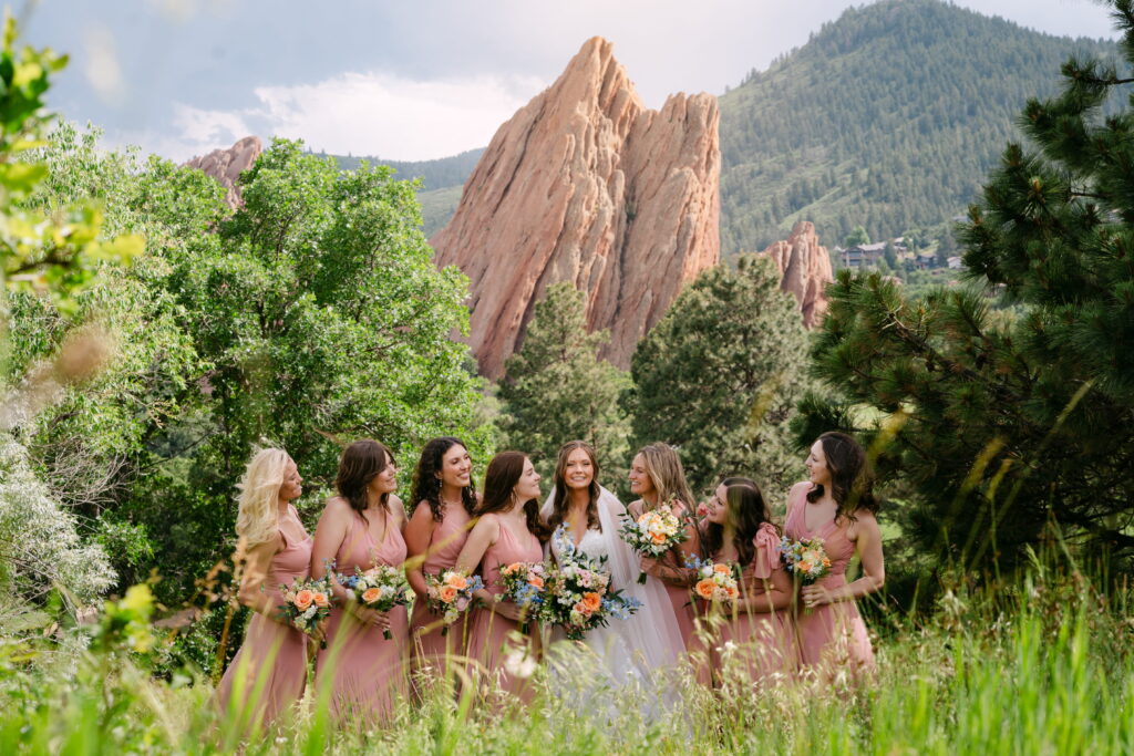 bridal party photos in front of the redrocks at arrowhead golf